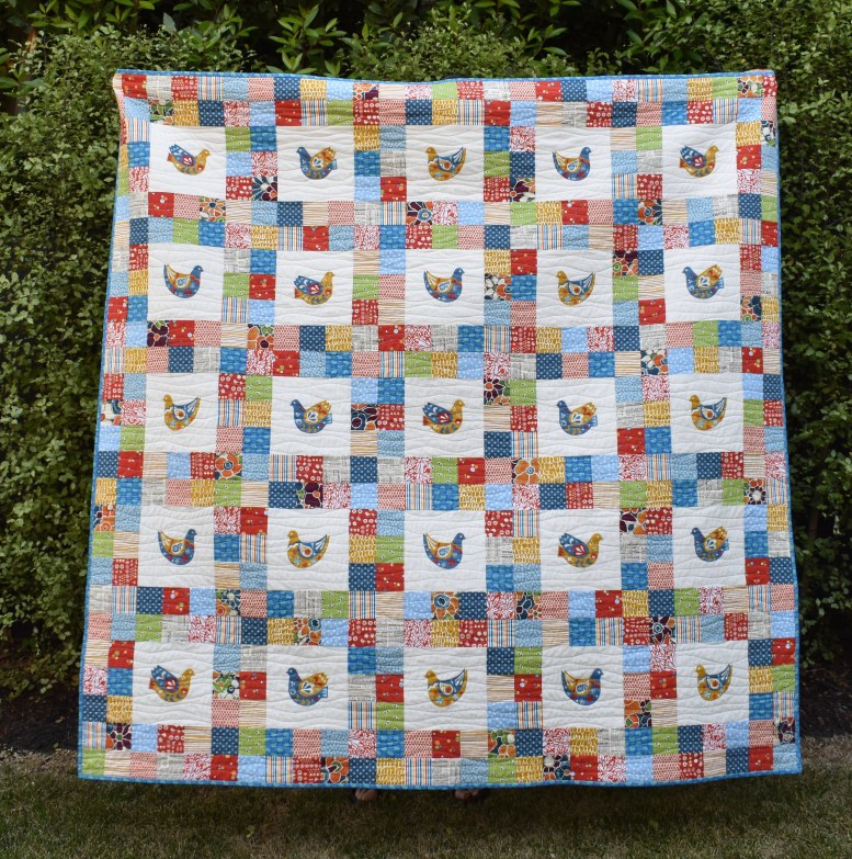 Scandi bird patchwork quilt